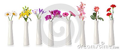 Flowers in tall white vases Stock Photo