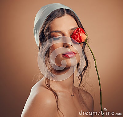 Flowers, thinking and woman with makeup beauty, floral wellness and creative on a brown studio background. Peace, flower Stock Photo