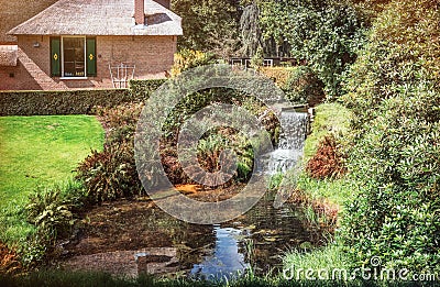 flowing brook at a house in the park at castle the castle Rosendael Editorial Stock Photo