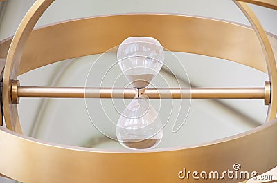 An hourglass is the simplest device for counting time, consisting of two transparent glass vessels Stock Photo