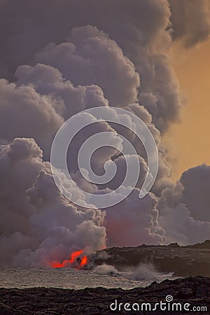 Flowing lava into the ocean Stock Photo