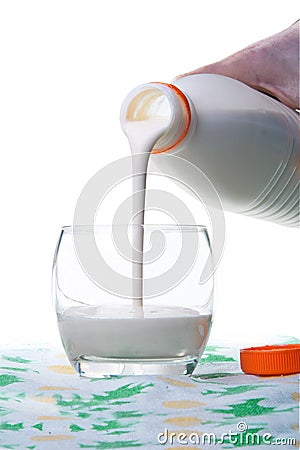 Flowing milk from bottle Stock Photo