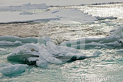 Flowing open river water jammed ice floes abstract Stock Photo