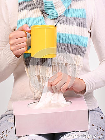 Flu cold. Sick woman with cup of tea and tissue box Stock Photo