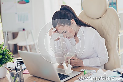 Flu at work. Tired sick business lady lawyer with strong migraine grimace. She is wearing the formalwear, sitting Stock Photo