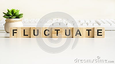 fluctuate word made with wooden blocks, concept Stock Photo