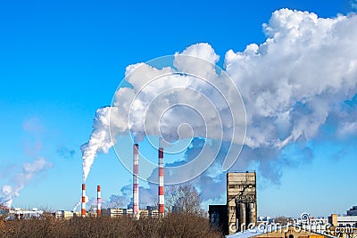 Flue pipes of a bakery and flour factory, industrial area of the city. Air emissions and food production Editorial Stock Photo