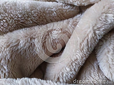 Fluffy Beige Bedcover Fabric Texture with heavy Folds and Crests Stock Photo