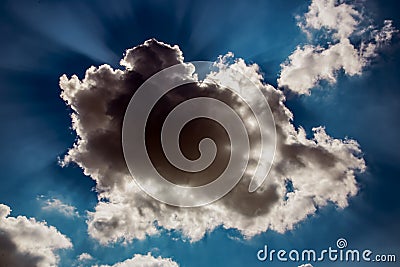 Fluffy cloud covering the sun Stock Photo