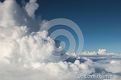 Fluffy clouds Cumulonimbus at high altitude over deep blue sky. Heaven, freedom, purity concept. Stock Photo