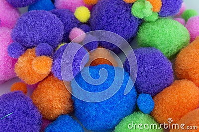 Fluffy colorful craft Pom Poms Stock Photo