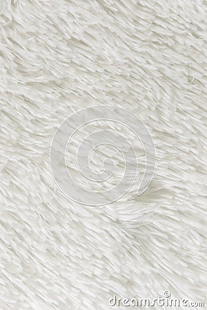 Fluffy plaid of polyester with a long heap gray. Comfortable home textiles. Background, texture Stock Photo