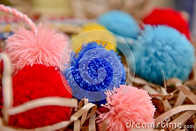 Fluffy pom poms with multi-colored threads. Stock Photo