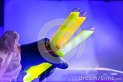 Fluorescein glowing in flask under ultraviolet ligh Stock Photo