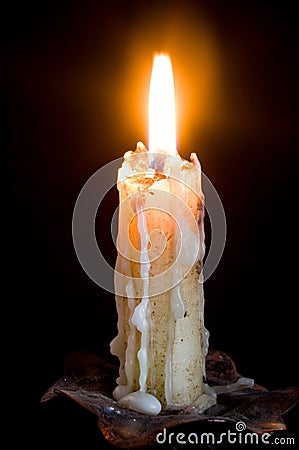 Flushed candle isolated in black and with the melted wax falling down Stock Photo