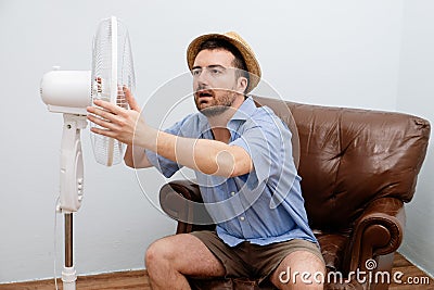 Flushed man feeling hot Stock Photo