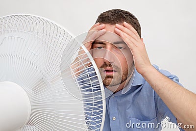 Flushed man feeling hot Stock Photo