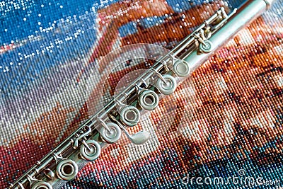 Flute on a bright colored background of beads Stock Photo