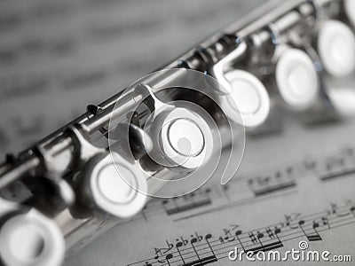 Flute and music score Stock Photo