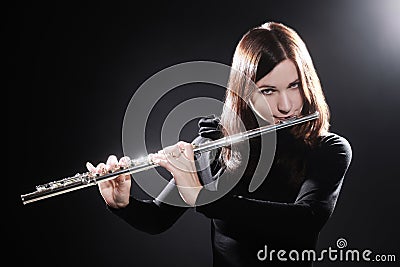 Flutist playing flute music Stock Photo