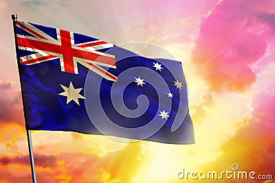 Fluttering Australia flag on beautiful colorful sunset or sunrise background. Success concept Stock Photo