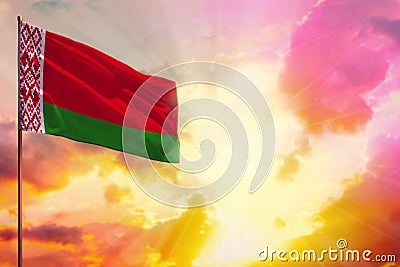 Fluttering Belarus flag in top left corner mockup with the space for your text on beautiful colorful sunset or sunrise background Stock Photo