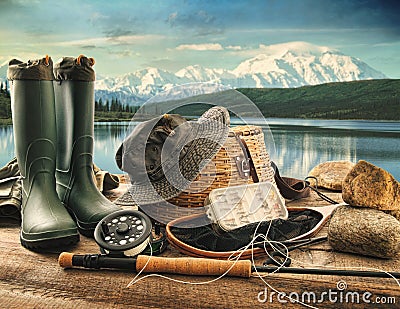 Fly fishing equipment on deck of mountains Stock Photo
