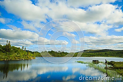 Fly fishing on the mountian lake Editorial Stock Photo