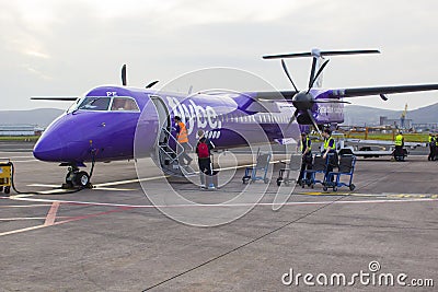 A FlyBe Dash 8 Commercial Airliner at George Best City Airport Editorial Stock Photo