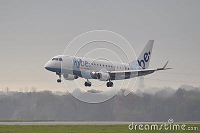 Flybe Embraer ERJ-175 Aircraft Landing Editorial Stock Photo