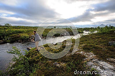 Flyfisherman in wilderness Editorial Stock Photo