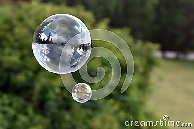 Flying through the air blowing bubbles Stock Photo