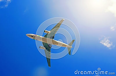 Flying aircraft in the blue sky Stock Photo