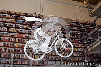 Flying bicycle. Books store in Lisbon, Portugal. Livraria Ler devagar. LX Factory. Tourism. Education. Visit Portugal. Stock Photo