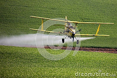 Crop Duster spraying Stock Photo