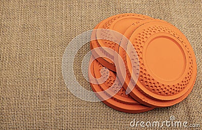 Flying clay pigeon target on burlap background , shooting game Stock Photo