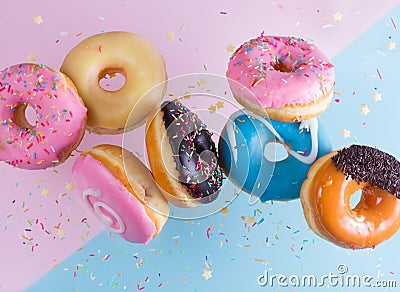 Flying doughnuts on blue Stock Photo