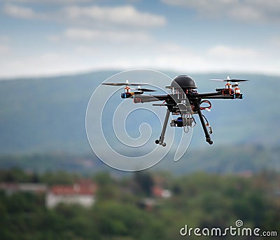 Flying drone with camera Stock Photo