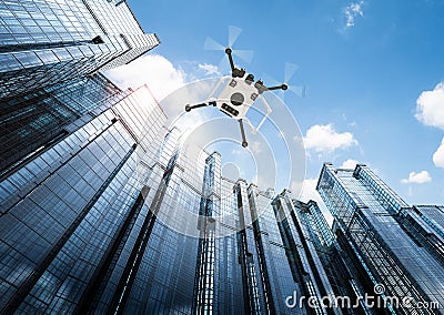 Flying drone in city Stock Photo