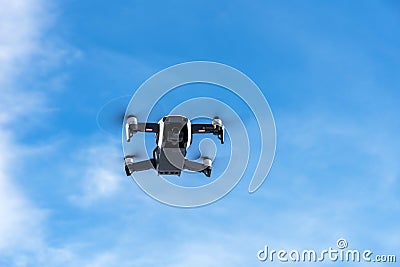Myvatn, Iceland - 10 March 2020: Flying drone Dji Mavic Air against the blue sky Editorial Stock Photo