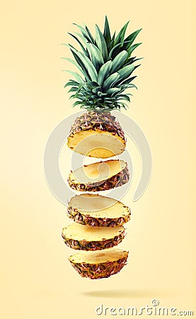 Flying fresh ripe pineapple cut into slices Stock Photo