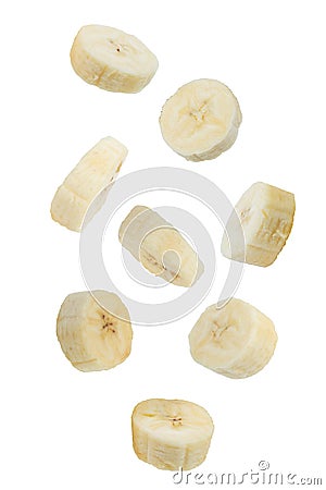 Flying fruits. Falling sliced banana fruit isolated on white background with clipping path as package design element Stock Photo