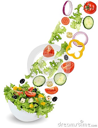 Flying green salad with tomatoes, onion, paprika, olives and cucumber Stock Photo