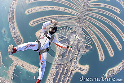 Flying men on Dubai Palm Stock Photo