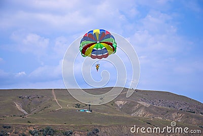 Flying paraglider in the mountain Stock Photo