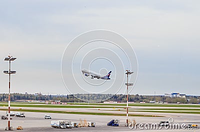 A flying passenger plane at the Sheremetyevo airport Editorial Stock Photo