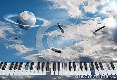 Flying piano keys are getting blown apart. Against the background of the blue sky, in the white clouds Stock Photo