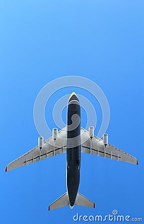 Flying plane in the blue sky Stock Photo