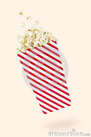 Flying popcorn with red-touched packet Stock Photo