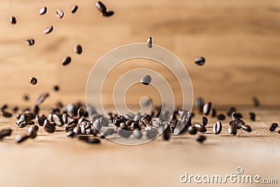 Flying roasted brown coffee beans Stock Photo